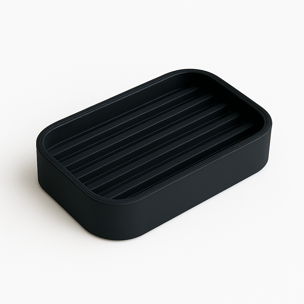 Black rectangular dish with ribbed design on a white background